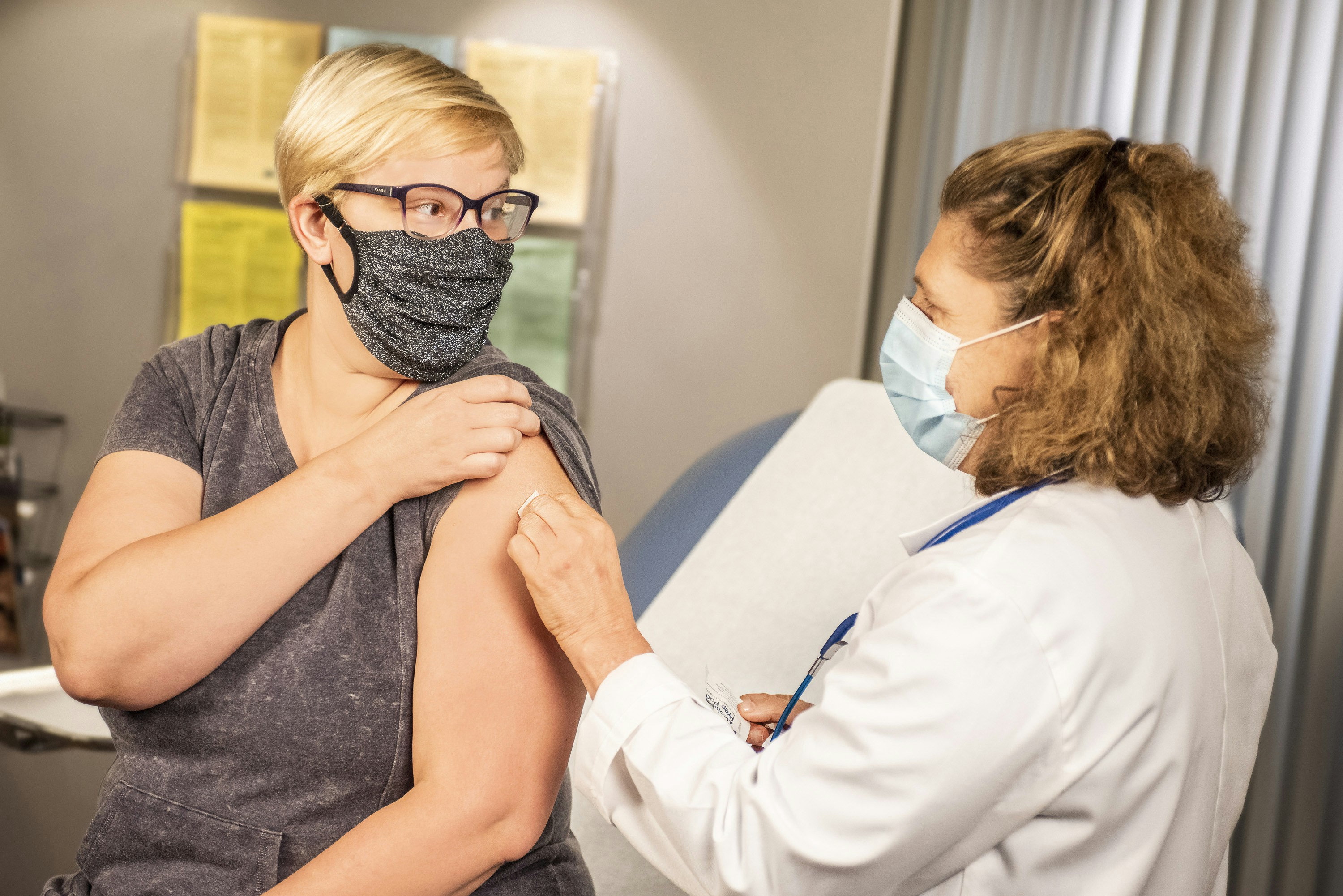 Professional pharmacist administering vaccine - WellPharma Immunization Services
